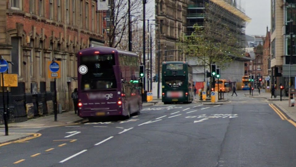 Man on roller skates hit by a bus in Manchester city centre.