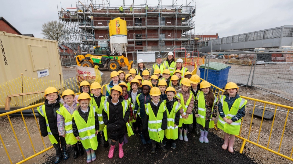 School pupils make a muddy boots visit to learn more about modern construction methods in Failsworth