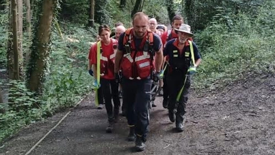 Mountain rescue team rush to help injured biker